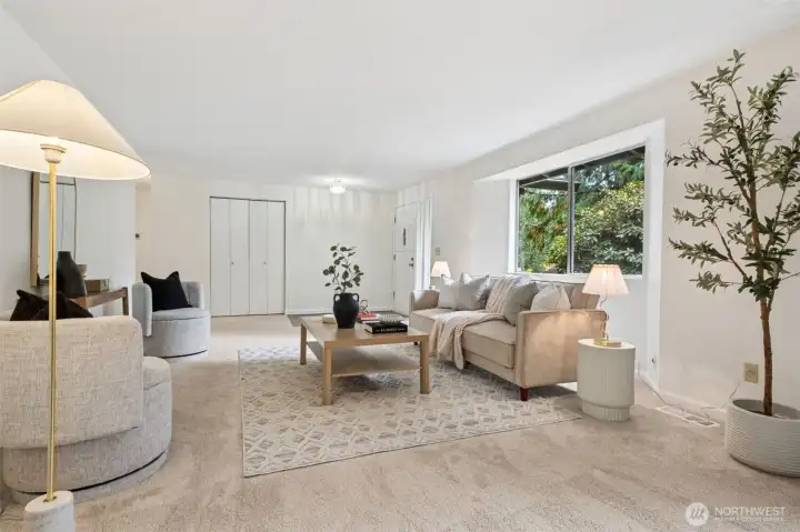 Natural light highlights the soft, new carpeting and fresh finishes, creating a welcoming first impression.