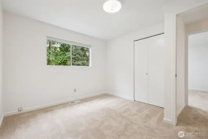 Bedroom #2 with soft new carpet and fresh paint throughout!