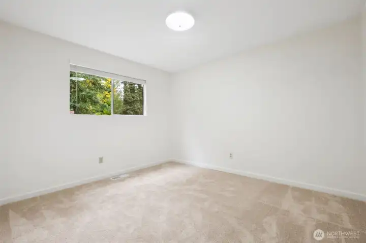 Bedroom #3 with soft new carpet and fresh paint throughout!
