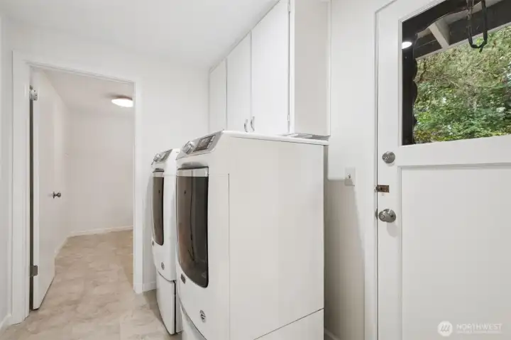 Spacious, light-filled laundry room with washer and dryer included for added convenience. The large layout provides plenty of room for folding, organizing, or even extra storage. Easy access to the backyard.