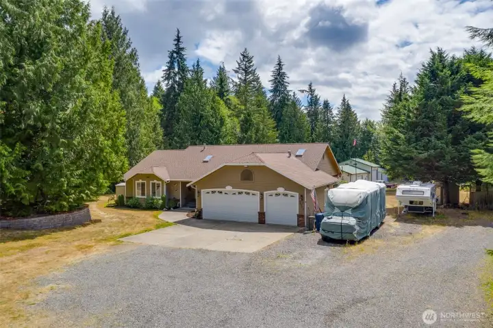 Plenty of parking for RV's and guests. A great home for entertaining! Large 3 car garage, generator, heat pump AC and more!