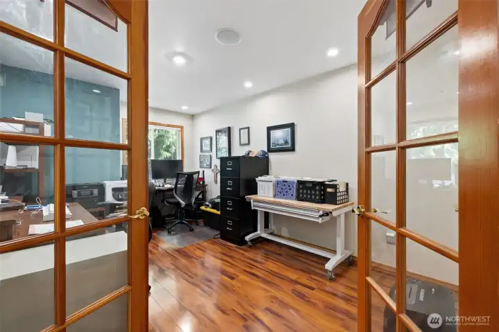 This is the den/office with double door entry and hardwood floors.