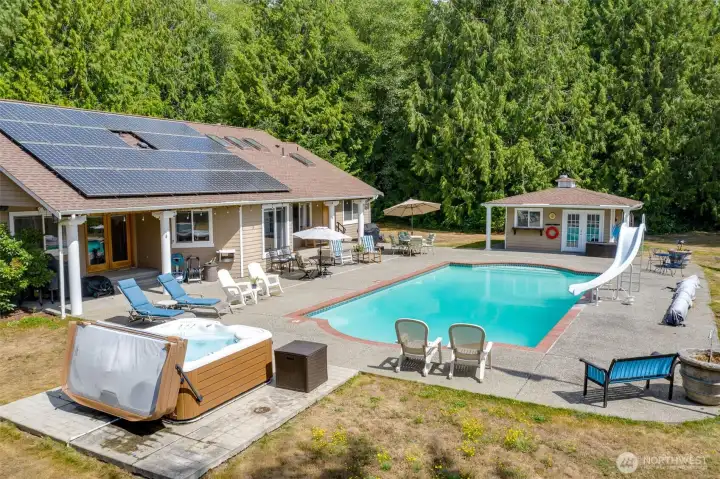 View of the back pool area. The pool is 7ft deep in the middle where the slide is.
