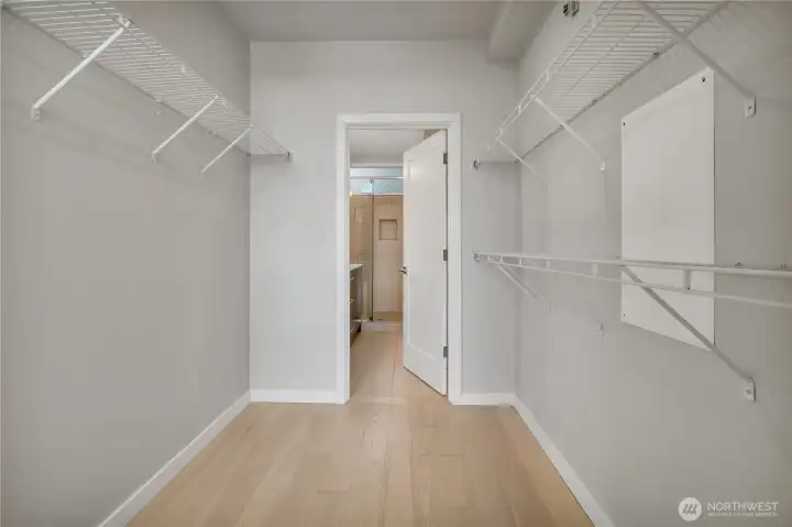 Primary bedroom walk in closet