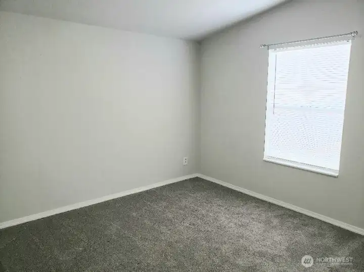 A Picture of the Really a Nice Size Second Bedroom Showing Newer Trim, and Carpet.
