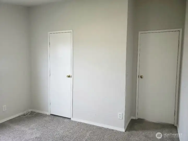 A Picture of the Third Bedroom Showing Newer Trim, and Carpet Showing Closet.