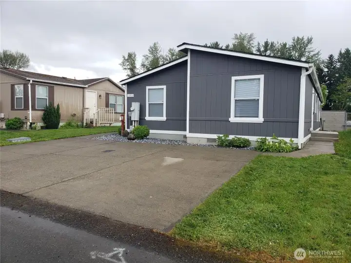 Another Front Picture of the Home Showing Parking for up to Three Vehicles.