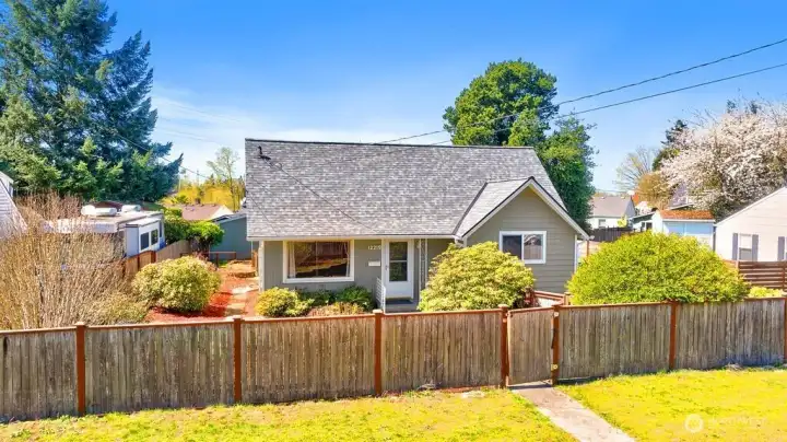 The fully fenced yard creates a safe, contained space for pets, play, and outdoor living.