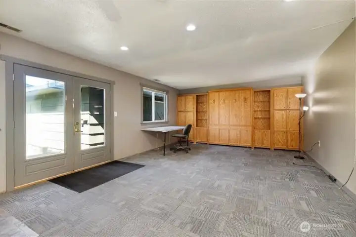 A built-in Murphy bed enhances the functionality of the family room.