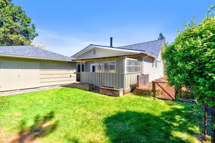 Backyard looking toward the 530 square foot garage and the enclosed back deck.