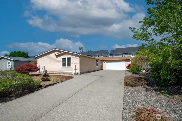Attached two car garage with ample driveway parking.
