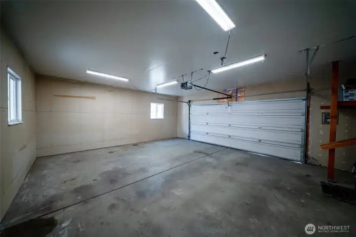 Attached two car garage with man door