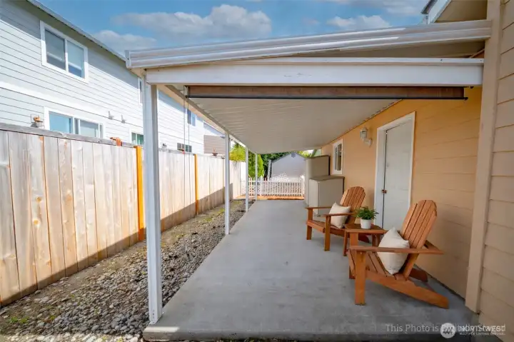 Covered back patio with additional storage - virutally staged