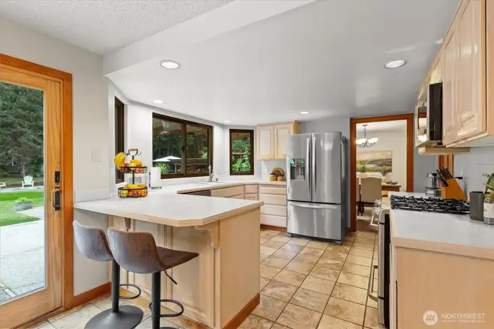 The kitchen is the heart of every home and this one is just perfect.  Tons of counter space and cabinetry make cooking a snap and you will love the convenient breakfast bar!