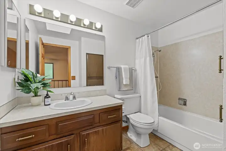 The full bathroom that is adjacent to the secondary bedrooms.