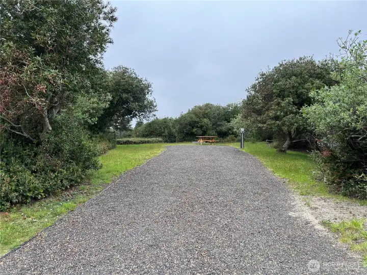 Long gravel driveway.