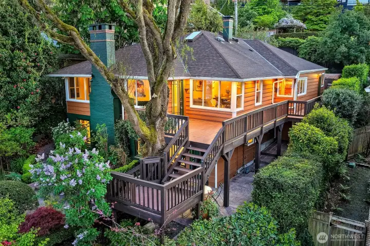Welcome to Portage Bay Living! Perched up over the bay for maximum privacy this beloved home is ready for its next chapter. Go past beautiful lush gardens and up a romantic wrapped deck to the front door complete with a great view of Portage Bay.