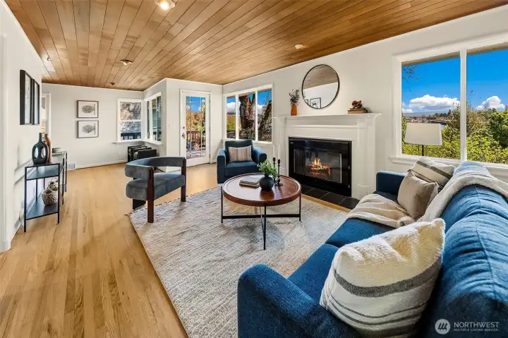 The inviting and spacious main level centers around big windows towards Portage Bay and a gas fireplace.