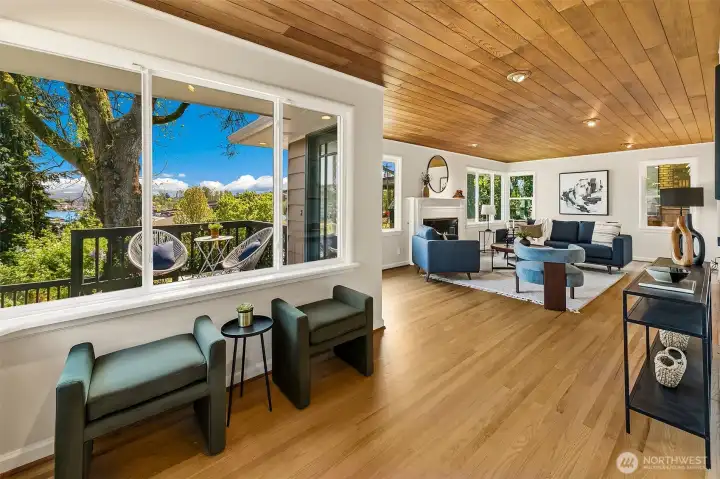 Newly refinished hardwood floors flow through living, dining & bedrooms past views east.