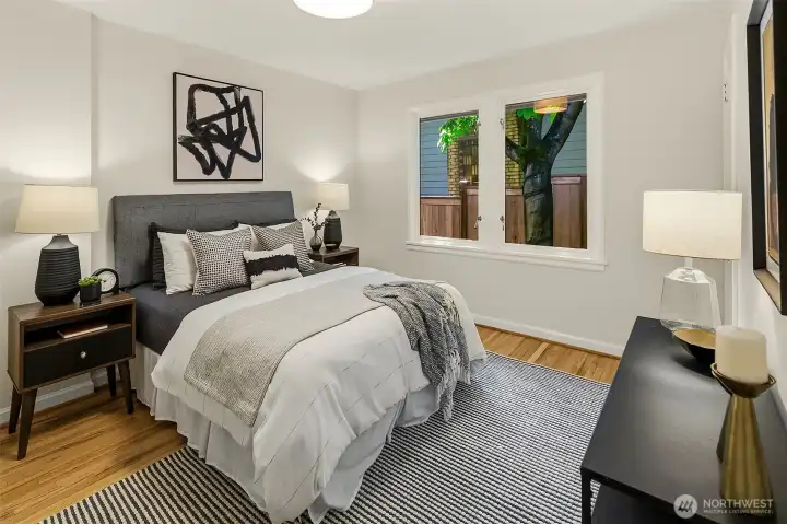 1 of 3 large main level bedrooms. This room has 2 closets & hardwood floors. Easily fits a king-sized bed!