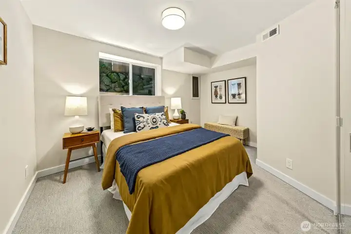 Lower level bedroom. Closet to the right. Window height may be non-conforming.