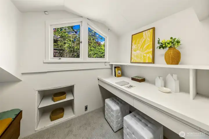 Upstairs, find a cute finished attic room with twin bunks and desks. Great for homework or work from home!