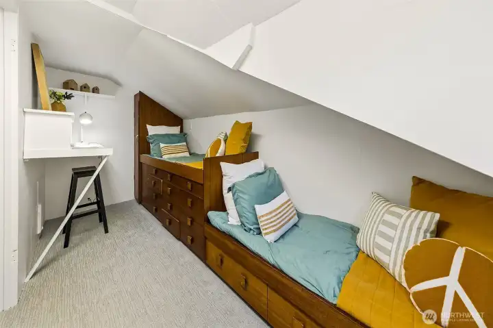 Another view of the finished attic room. To the left is an unfinished attic space that is great for storage or to finish out someday.