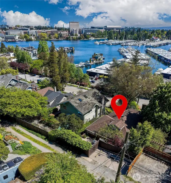 Drone view of the parking strip and house overlooking Portage Bay towards UW.