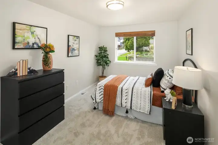 One of three upper bedrooms