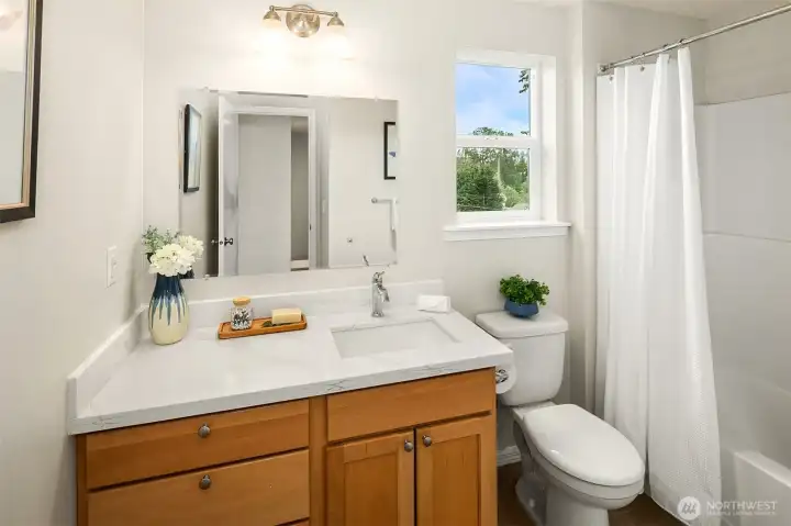 Full bath with west facing window
