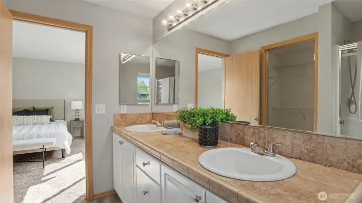 Primary ensuite opens seamlessly into the spacious primary suite, creating a private and comfortable retreat
