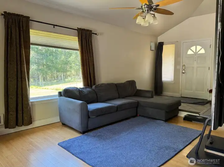 The vaulted ceiling of the living room really accentuates this open airy space.