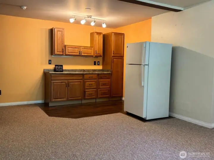 Downstairs you will find a kitchenette area that you can continue to build out for even more functional living.