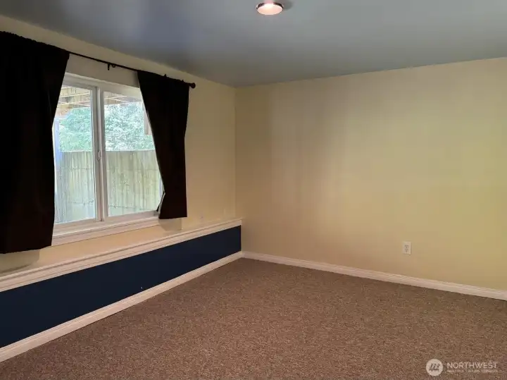 This downstairs bedroom is nicely sized.