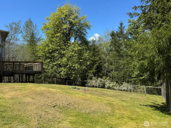Whether sitting on the large deck or exploring the expansive yard, your are going to love being outside here.