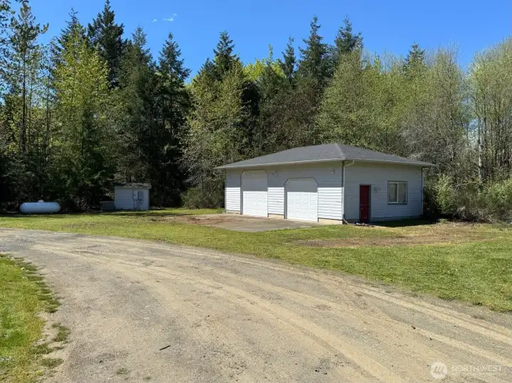The large shop is accompanied by a pump house, generator and propane tank.
