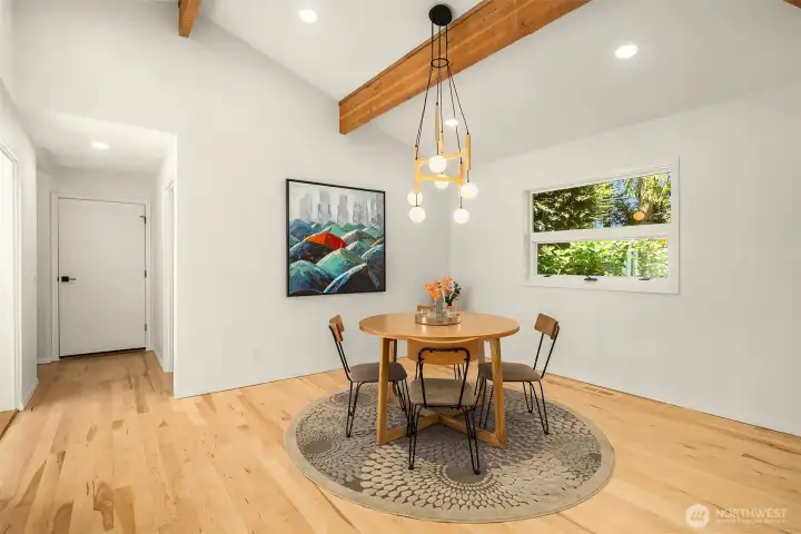 Dining room-showing door to 3 car garage and solarium on the left, Bathroom on the right
