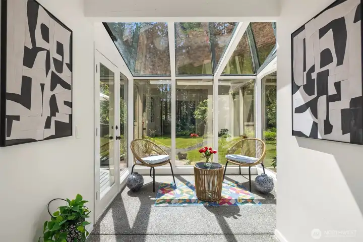 Solarium with backyard access, behind you is the Dining room