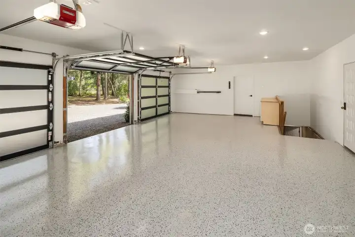 3 Car Attached Garage, Man door to Kitchen, Stairs to lower Level on the right