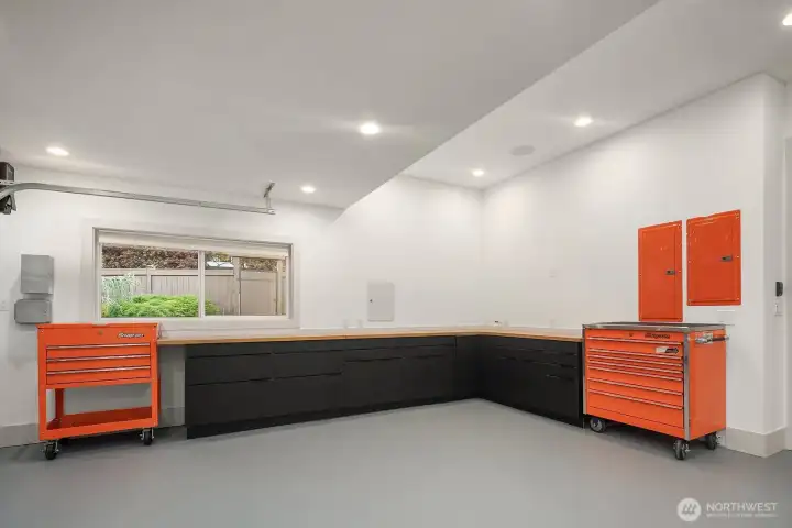 Two-car garage-new paint, heater, built-in cabinets, interior/exterior 240-volt EV charger