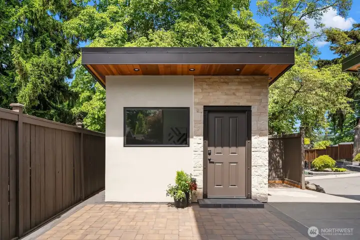 Stand alone studio in the same architecture as the house - drywalled, painted, LVP flooring, can lighting, built-in heater, and paver patio