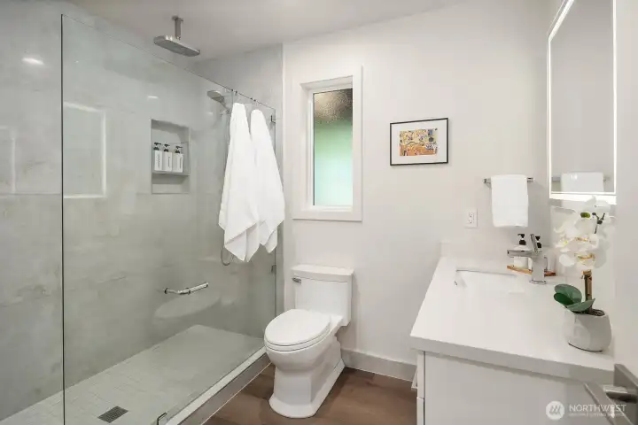 Lovely walk-in shower - rain shower head and detachable shower head, lighted mirror