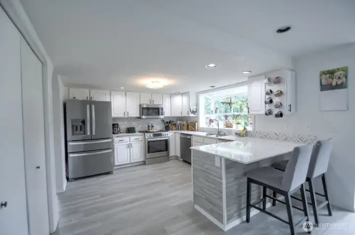 Beautifully updated kitchen with breakfast bar.