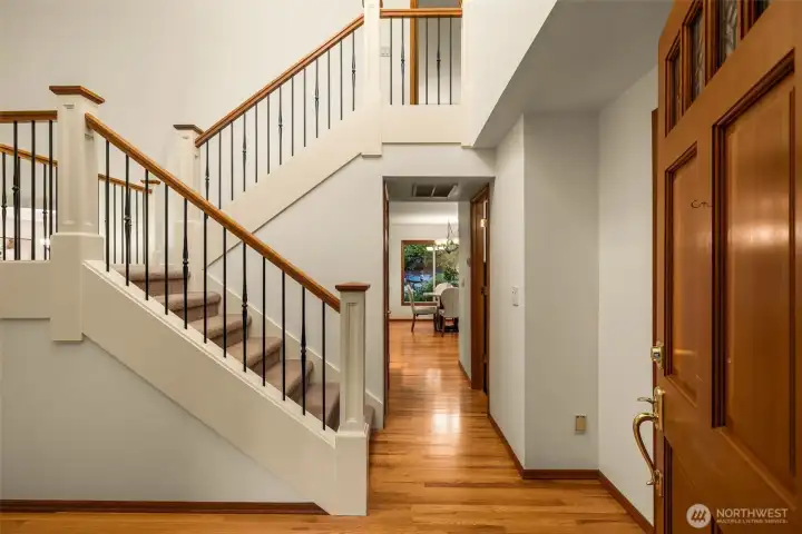 Beautiful entryway with newer staircase and abundance of light Beautiful entryway with newer staircase and abundance of light