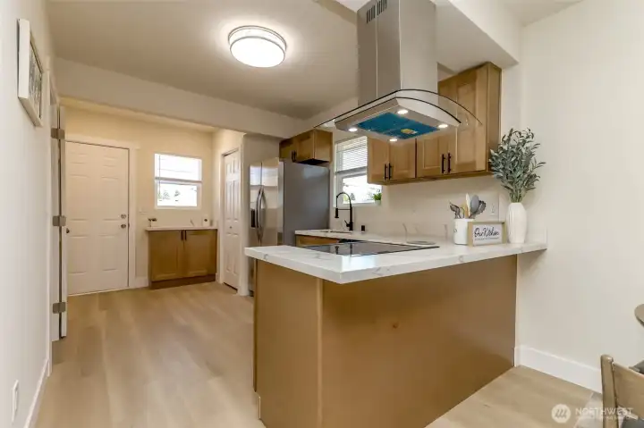 Brand new kitchen cabinets and sleek quartz countertops and brand spanking new appliances too!