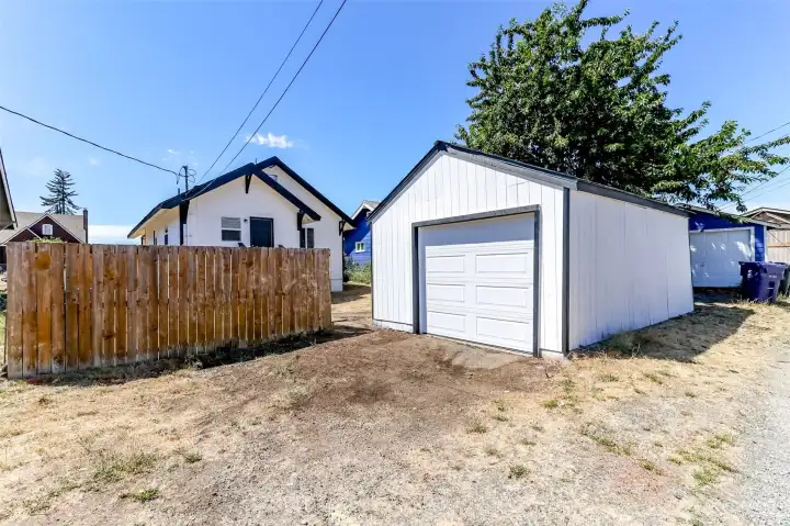 Extra roomy one car garage is perfect for parking, hobbies, storage, or workshop