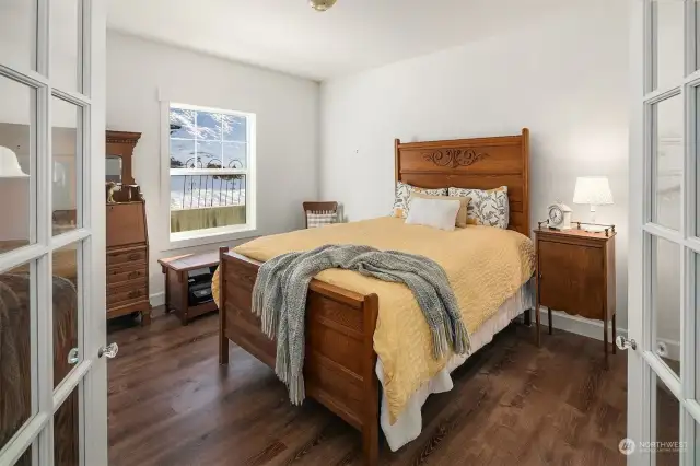 Lovely French doors lead into primary bedroom on main floor