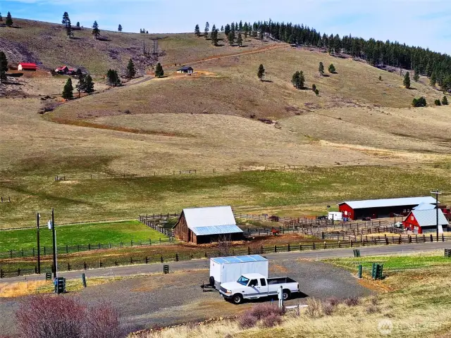 Looking from the home down to the RV parking/barn/garage building pad and across the valley to the hills of Swauk Valley