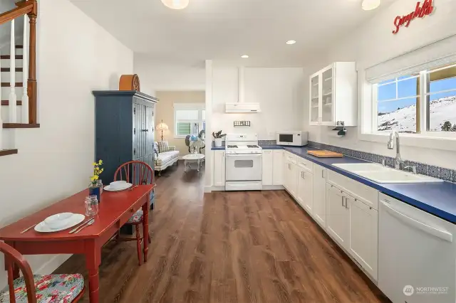 Kitchen area with eating space, all appliances stay, again, more spectacular views out the kitchen windows.