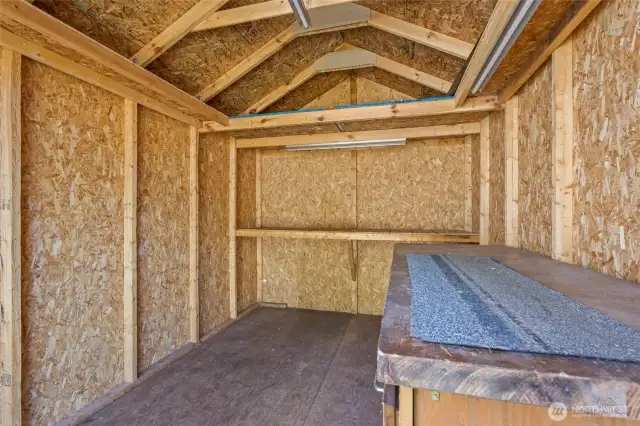 Plenty of room for tools and outdoor equipment. It even features a well lit workbench!